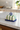 Smørskjuler fra klevering, styled på Carrara marmor i køkken